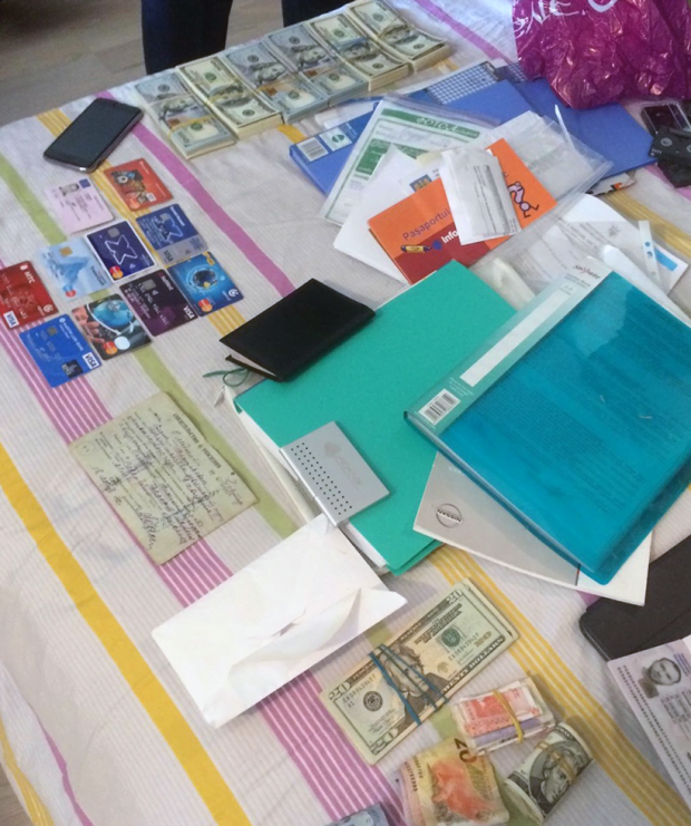 The seized cash, credit cards, IDs, financial documentation and more